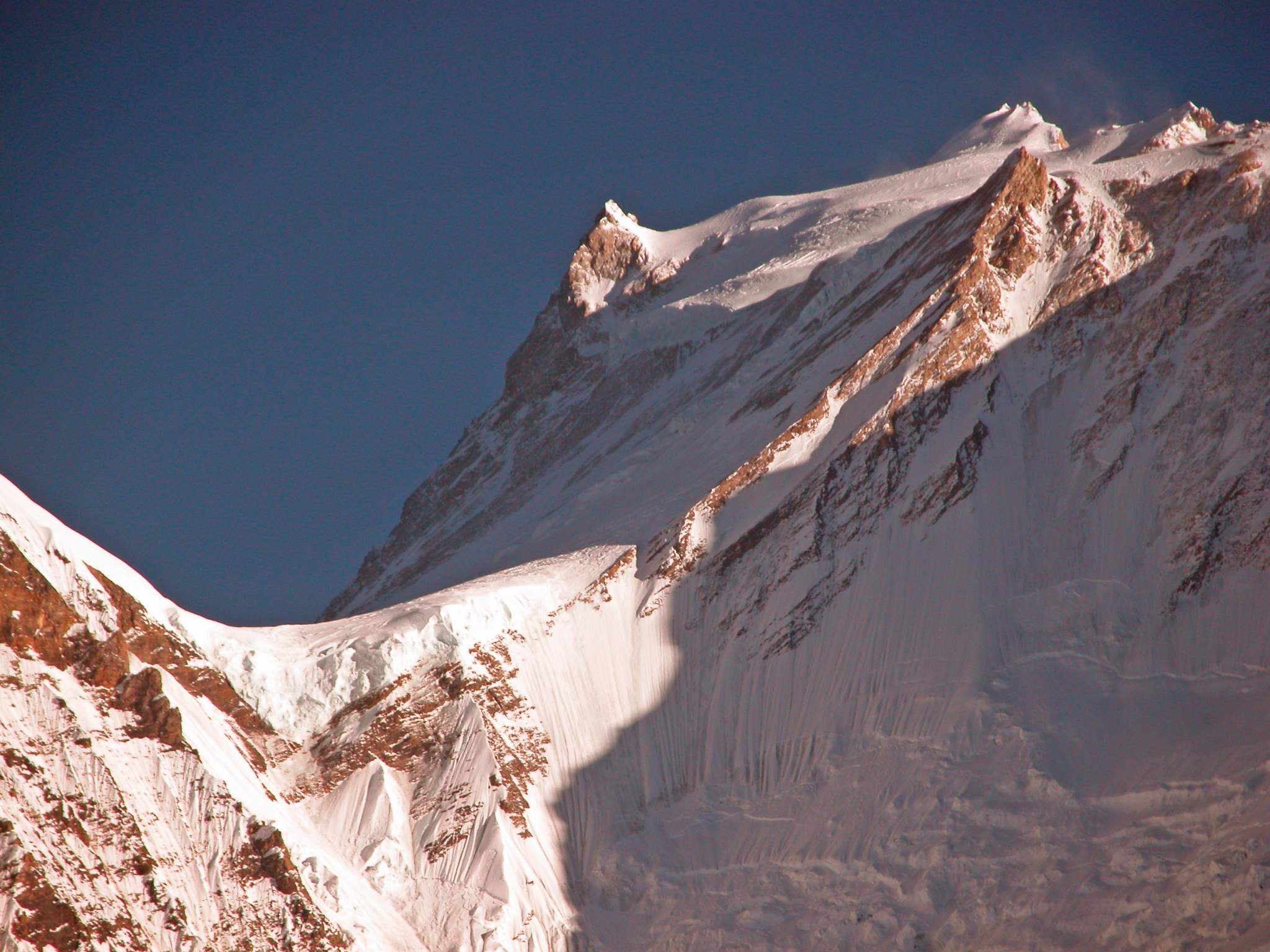Manaslu 09 09 Manaslu From Bimtang Here�s another closer view from Bimtang of the summit plateau of Manaslu with the East Pinnacle (7992m) on the left and the summit to the right.